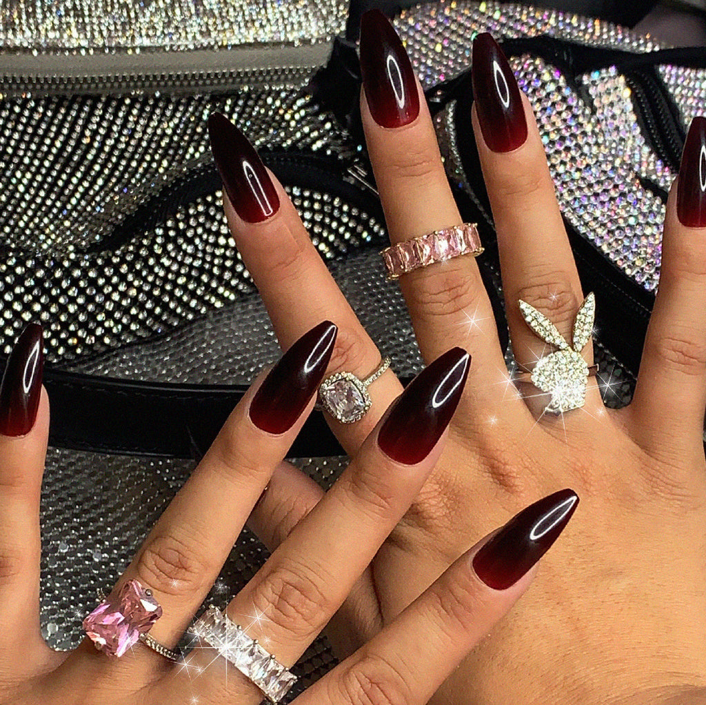 Influencer wears long ballerina press on nails in deep cherry red jelly