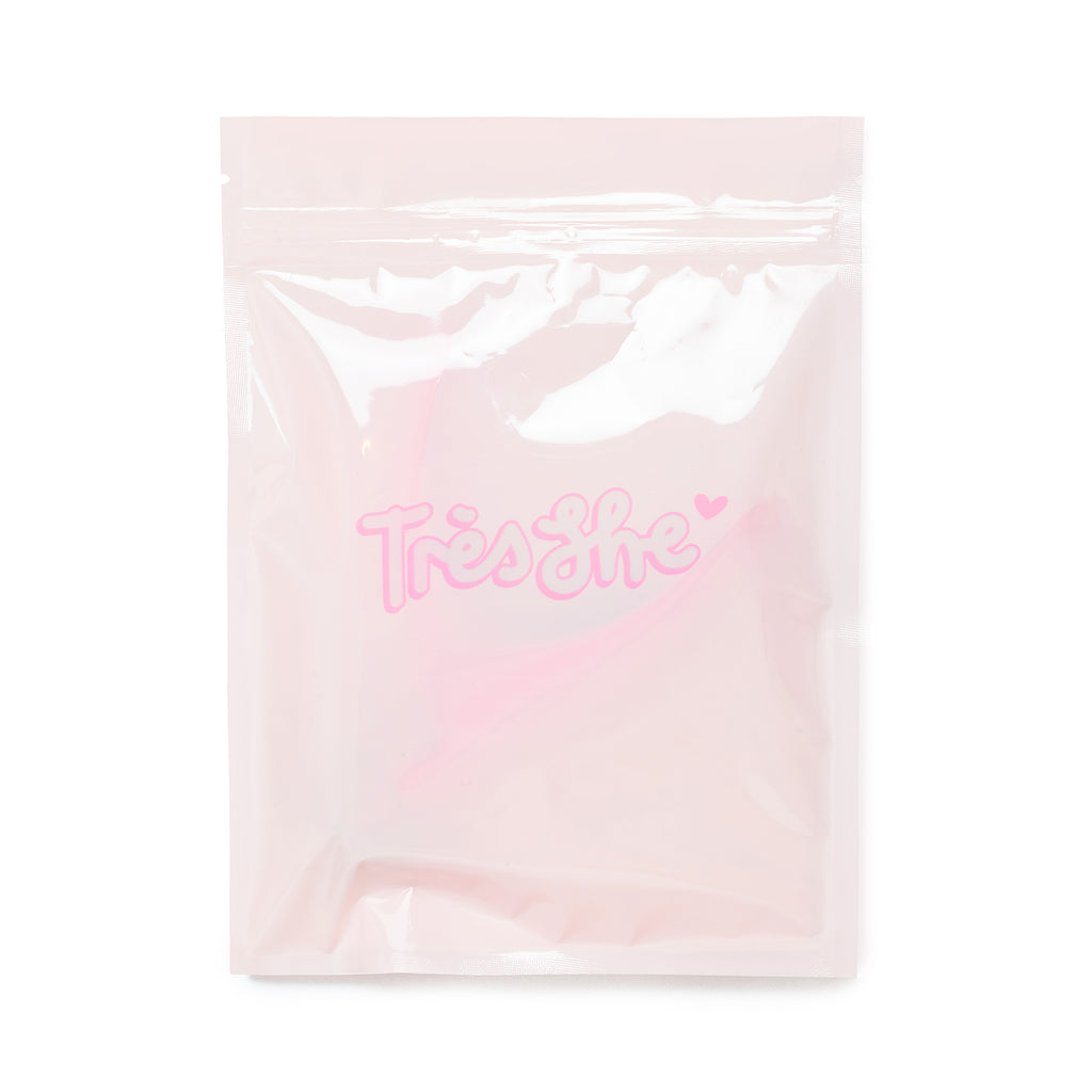Packaging of Tres She nail clippers, baby pink zip lock bag with Tres She logo