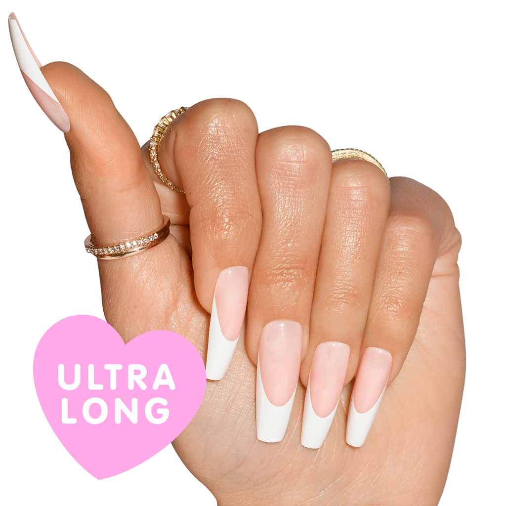 Hand wearing Porn Star nails, natural french tip, in coffin shape ultra long length with ultra long bubble