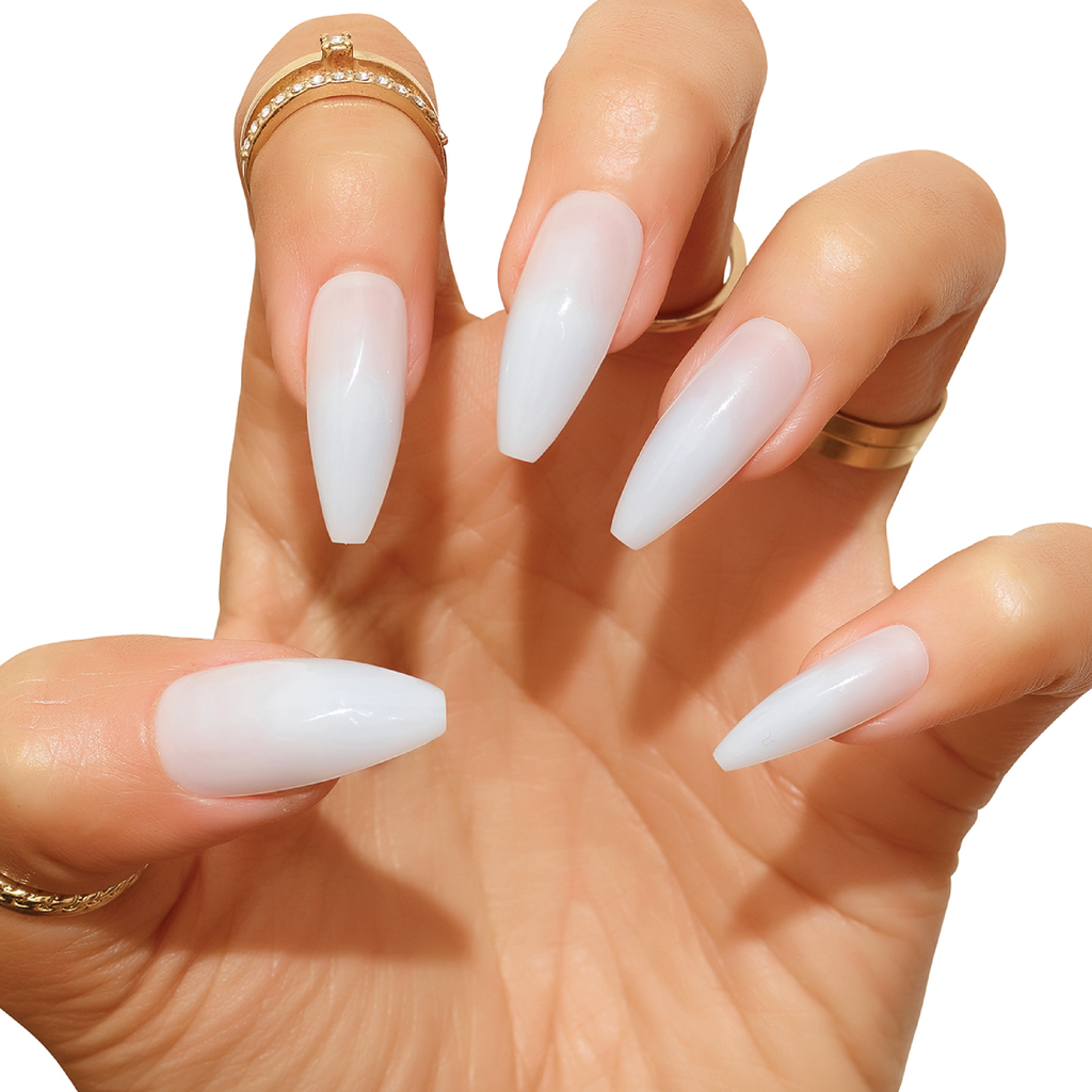 Hand wearing Cream Puff milky jelly acrylic nails in claw pose