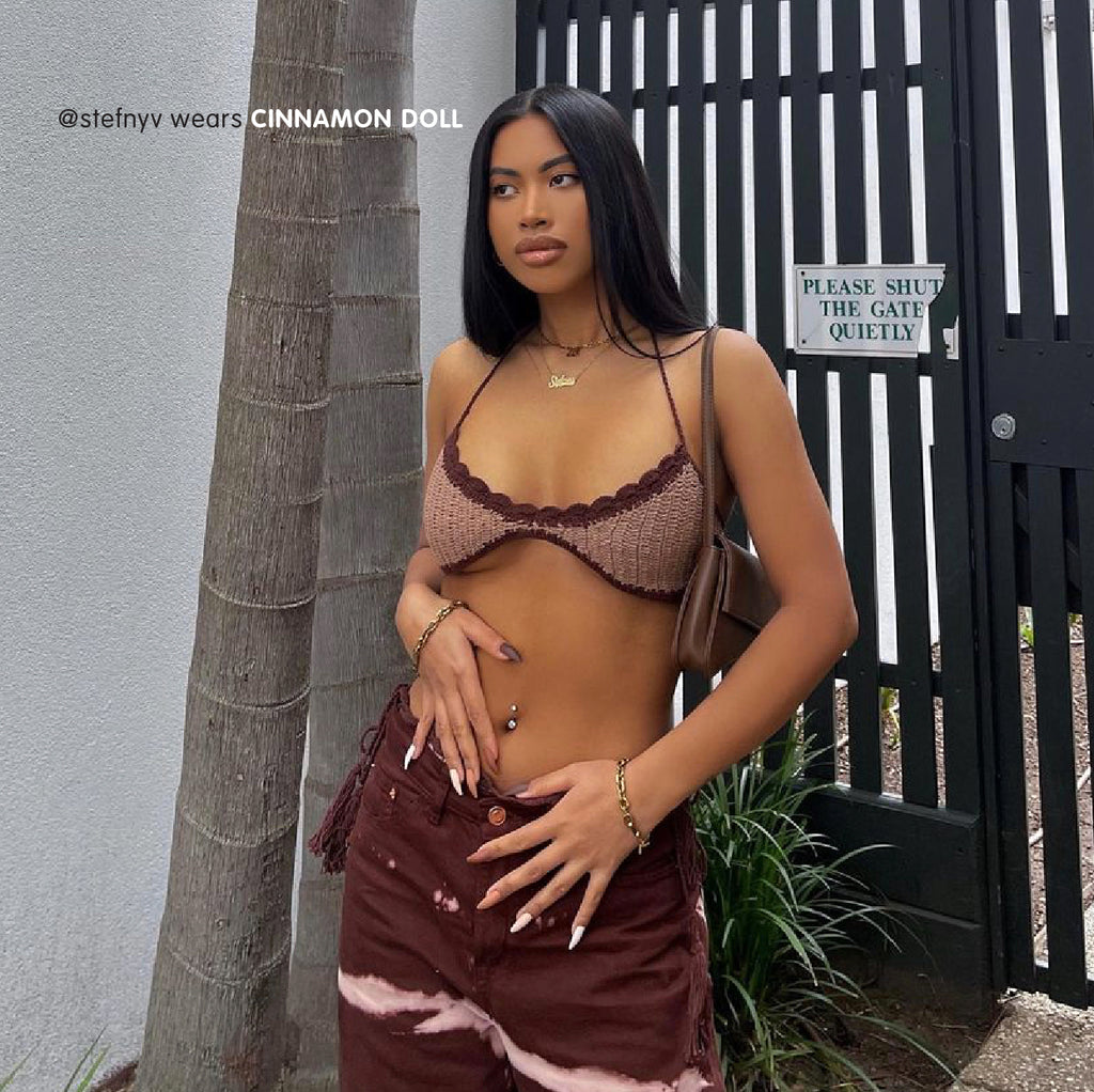 Influencer wearing Tres She instant acrylic press on nails in matte brown graduated shades long tapered ballerina shape
