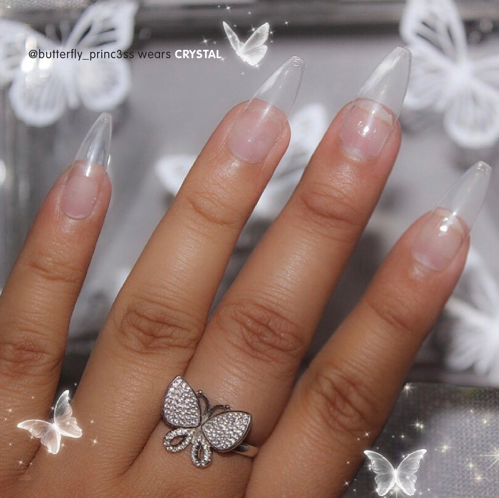 Influencer wearing long ballerina press on nails in clear