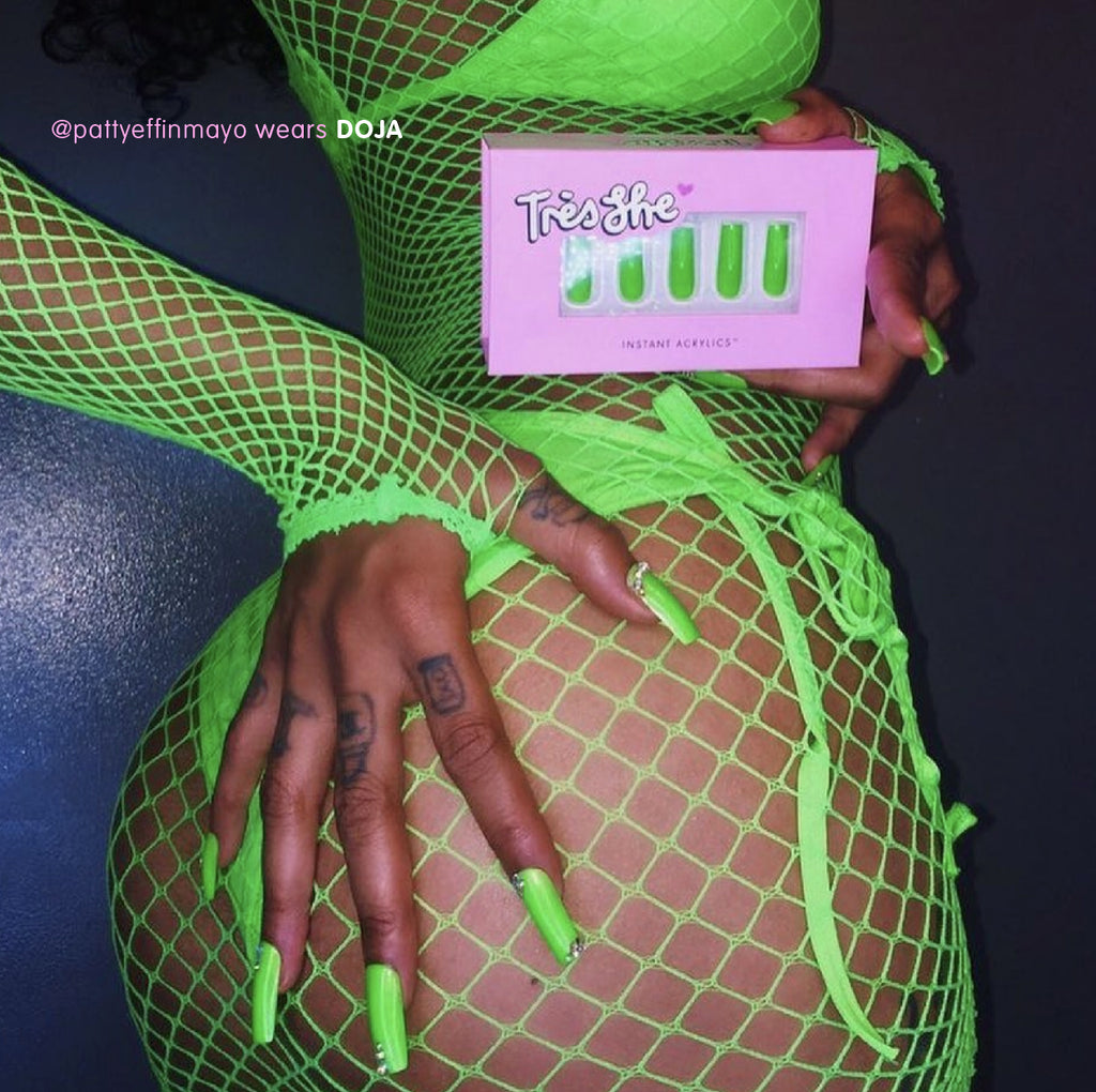 Influencer wears long square press on nails in bright green