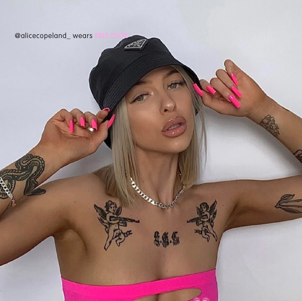 Influencer wears long square pink nails in bright pink
