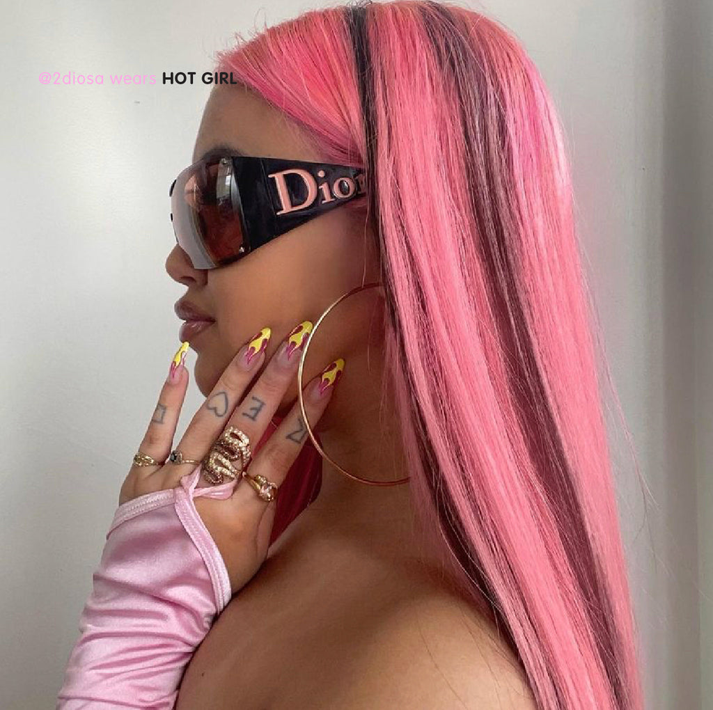 Influencer wearing long ballerina press on nails in neon yellow and pink flames