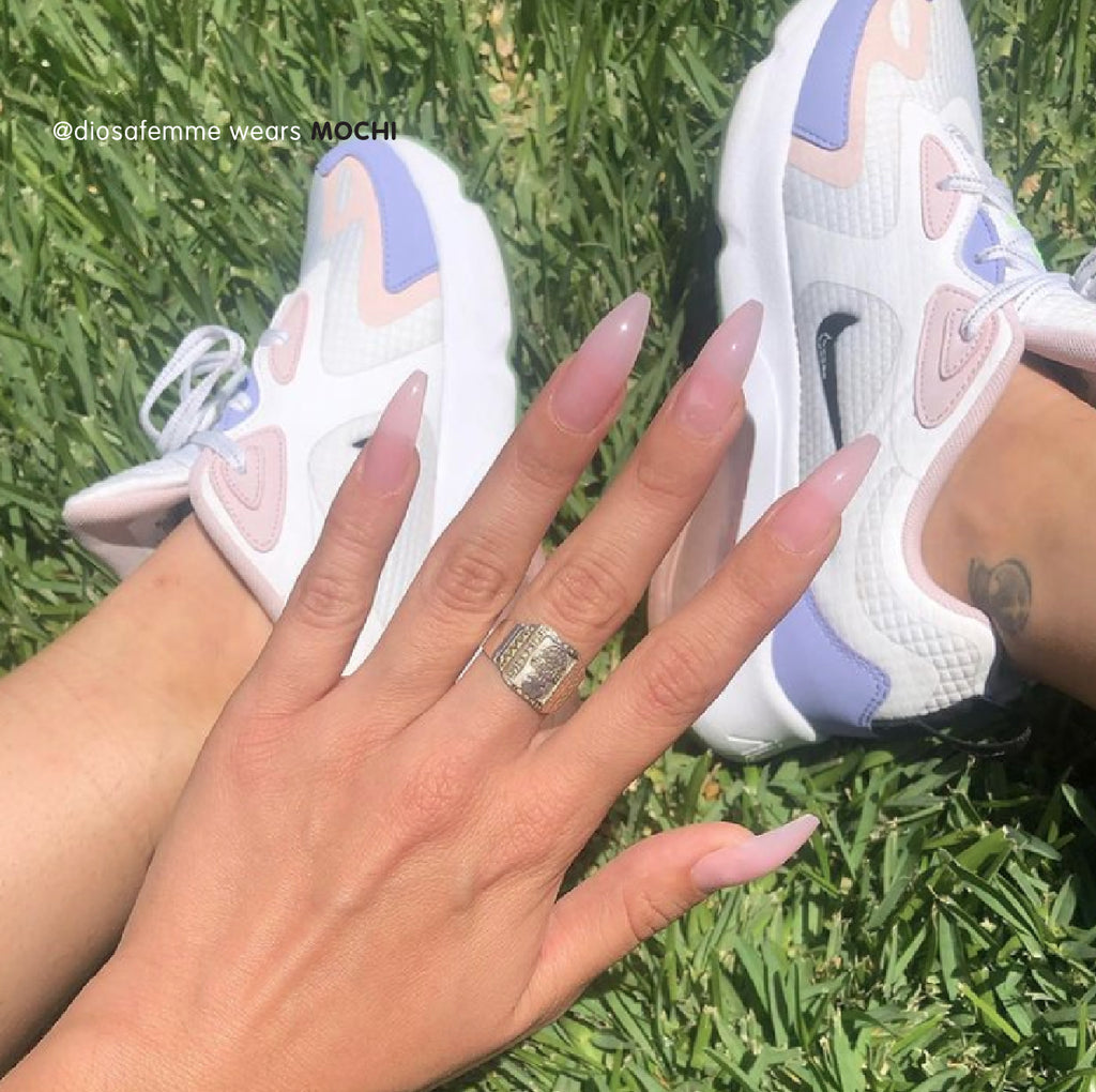 Influencer wearing baby pink sheer jelly long ballerina press on nails