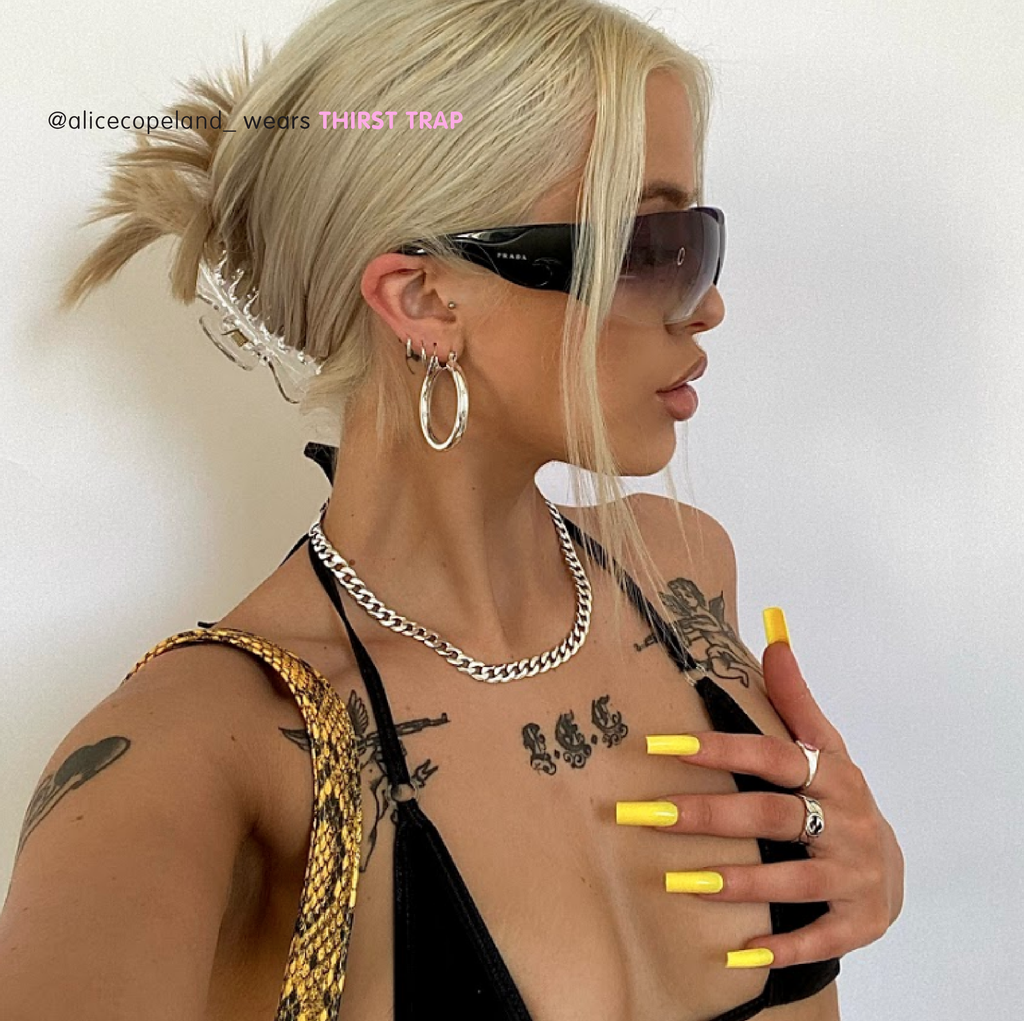 Influencer wears Tres She press on instant acrylic nails in bright yellow long square