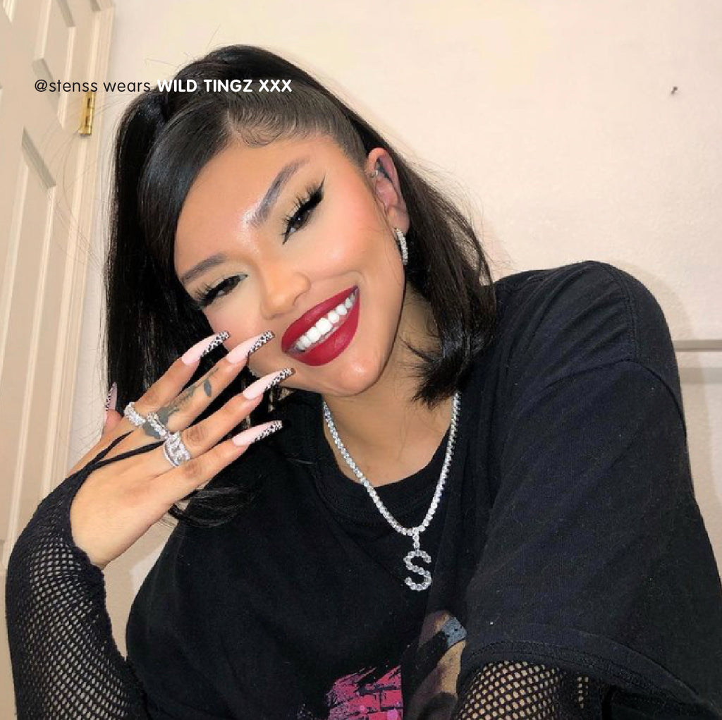 Influencer wears ultra long press on nails in matte nude with leopard print v tip