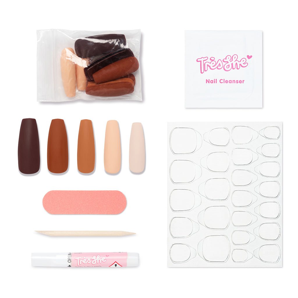 Pack contents of Cinnamon Doll Ultra Long press on nails includes different shades of nude nails, glue, cuticle stick, buffer, alcohol wipe, adhesive stickers