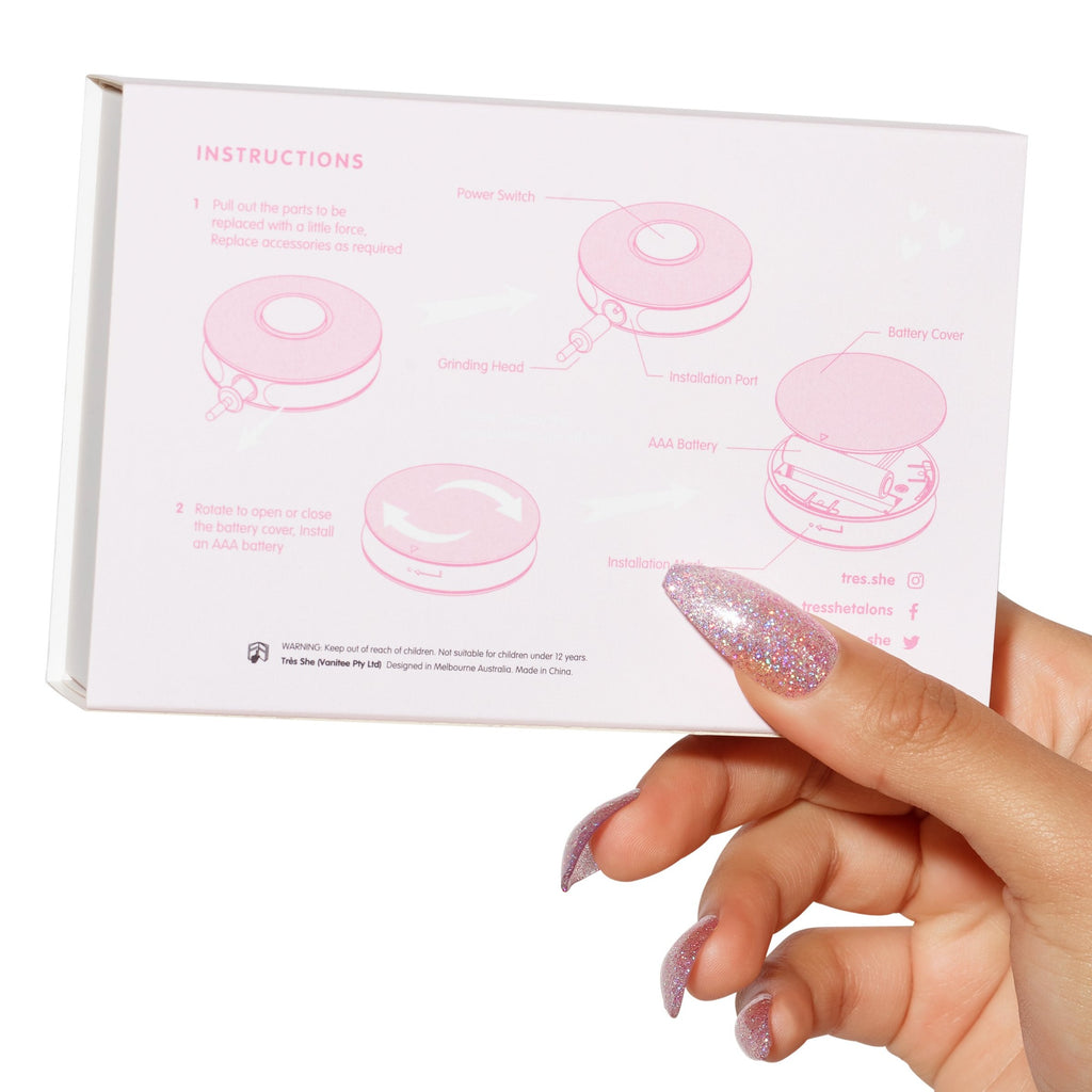 Hand holding packaging box of mini e file with instructions